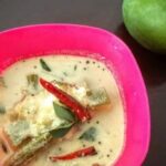 A bowl of raw mango drumstick curry.