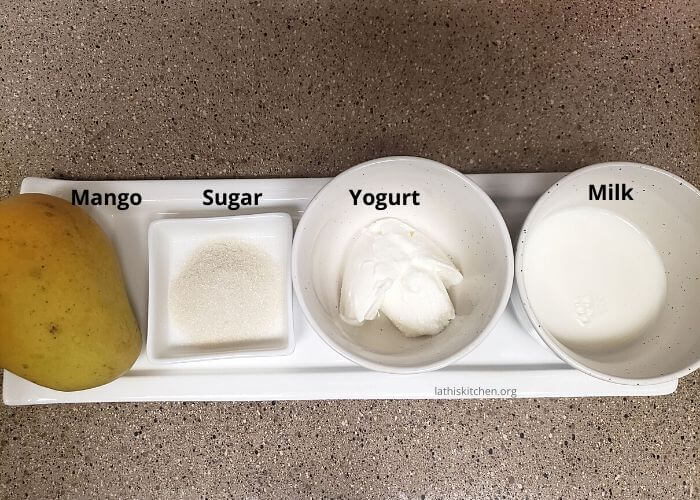 Ingredients to make mango lassi.