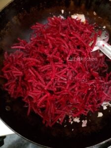 Grated beetroot add to the pan with sauteed onions and spice powders.
