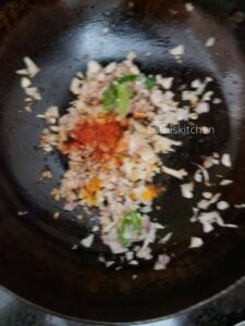 Pan with sauteed onions and spice powders.