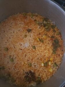 Pan with cooked rice.