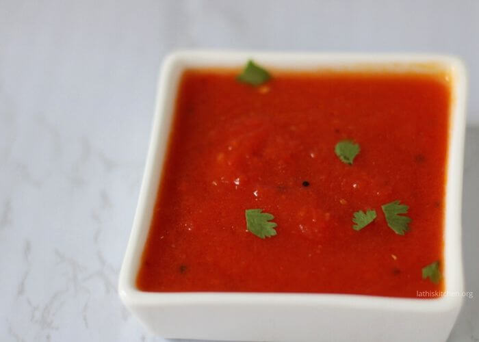 A bowl of tomato chutney.