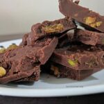 A plate of homemade chocolate with dry fruits.