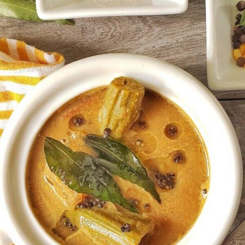 Bowl of Kerala Sambar with jeera seeds on side.