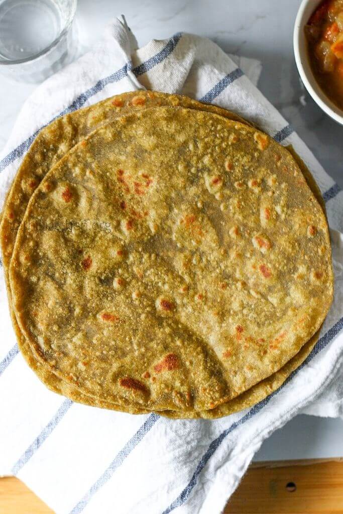 Top view of palak paratha on a towel.
