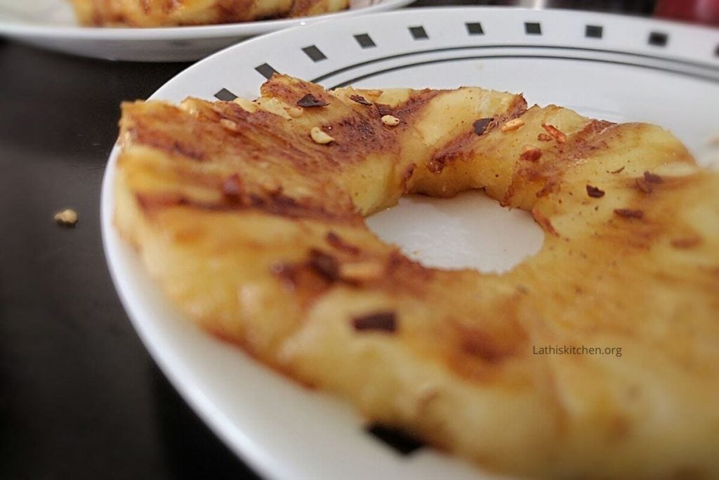 Grilled pineapple with red chili flakes.