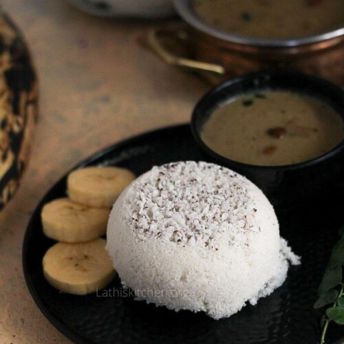 A plate with rice flour puttu served with banana and kadala curry in a bowl.