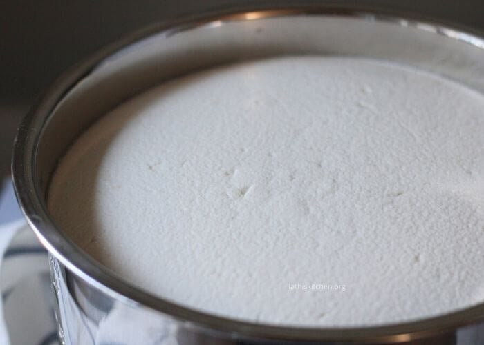 Fremented Idli dosa batter in a pot.