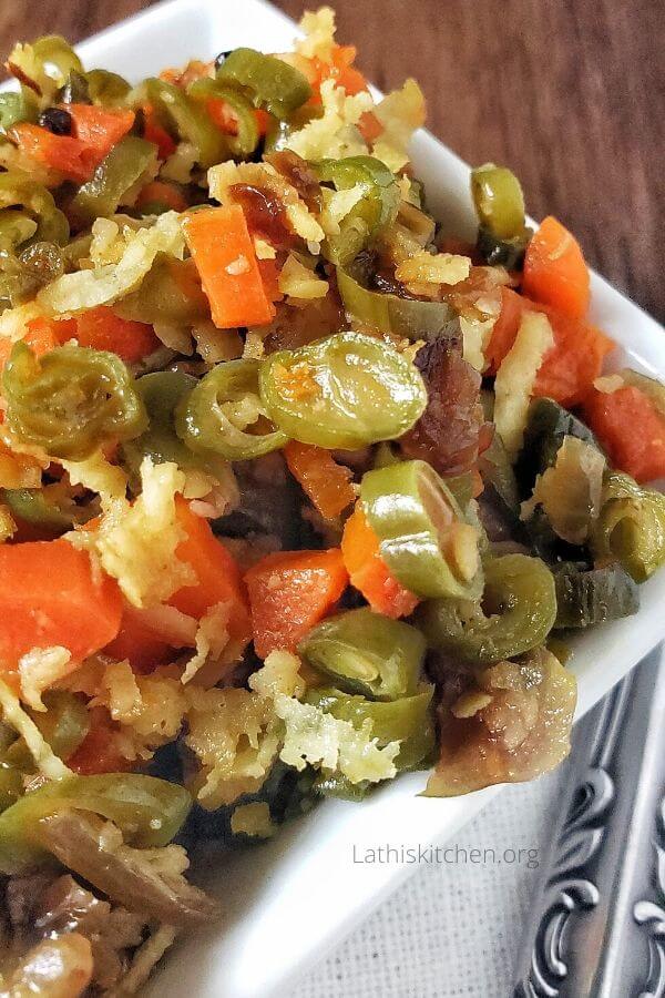 A bowl of carrot beans stir fry.