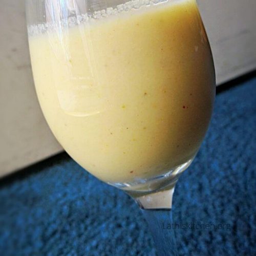 A glass of Mango Pistachio smoothie.