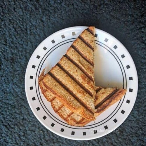 Slice of matar paneer stuffed sandwich.