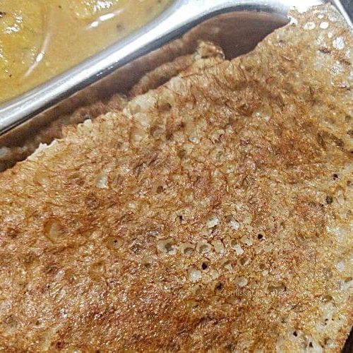 Oats dosa in a plate with sambar.