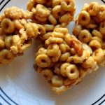 A plate with peanut butter cheerios bar.