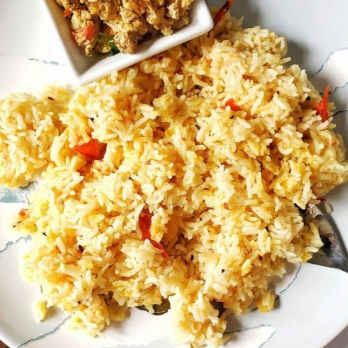 Plate of Lentil rice with scrambled eggs.
