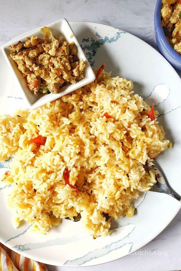 A plate of lentil rice and egg bhurji.