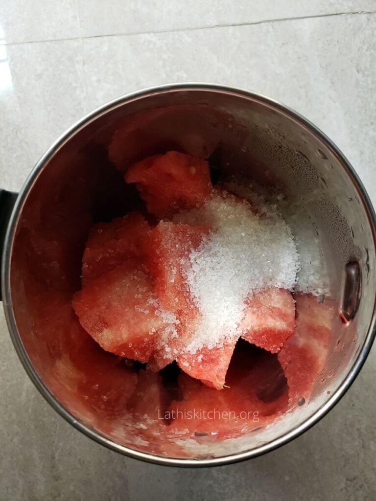 Mixer with watermelon cubes, lemon juice and sugar.