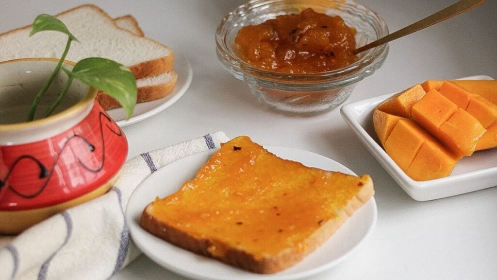 A plate of bread slice with homemade mango jam.