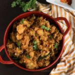 A bowl with Indian spiced mashed potatoes.