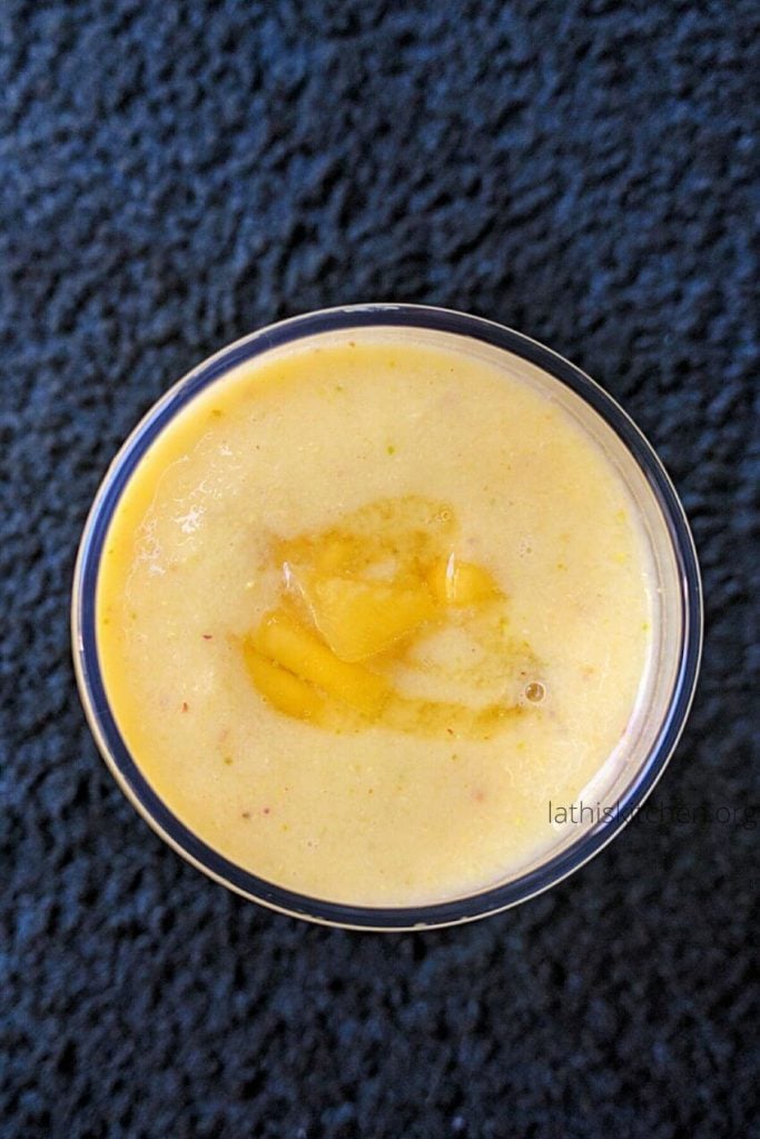 Mango Pistachios smoothie in a glass.