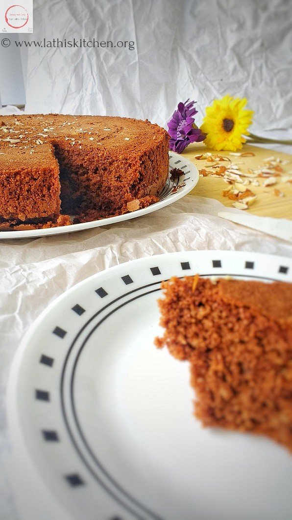 Mexican chocolate cake in a plate with a slice cut off.