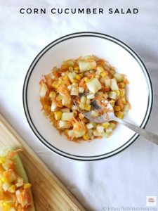 Bowl with corn cucumber salad.