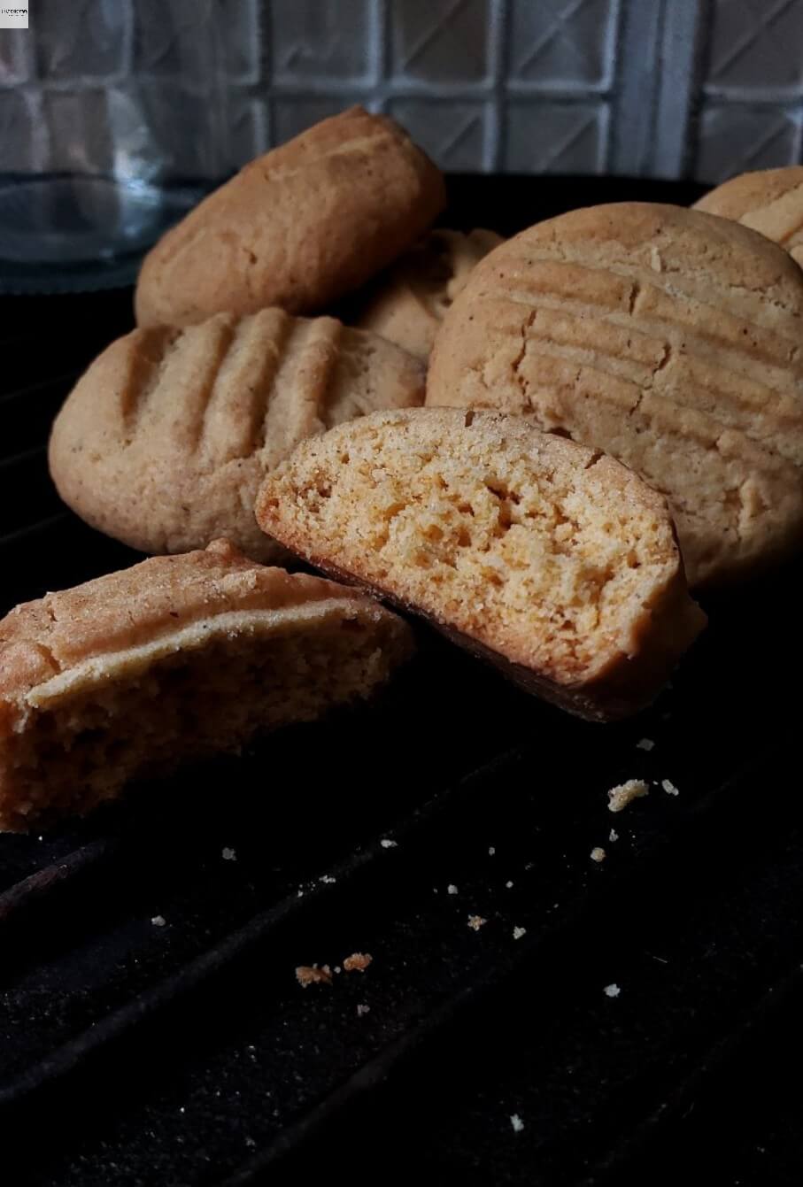Eggless Custard cookies with half broken cookie.
