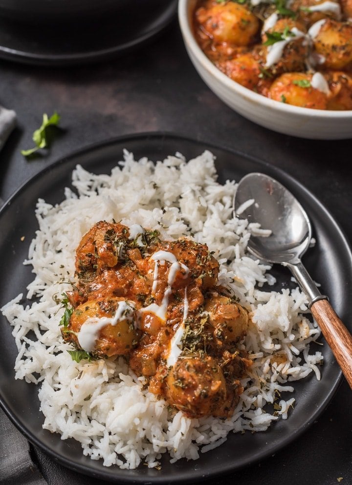 Plate of rice with Dum aloo curry.