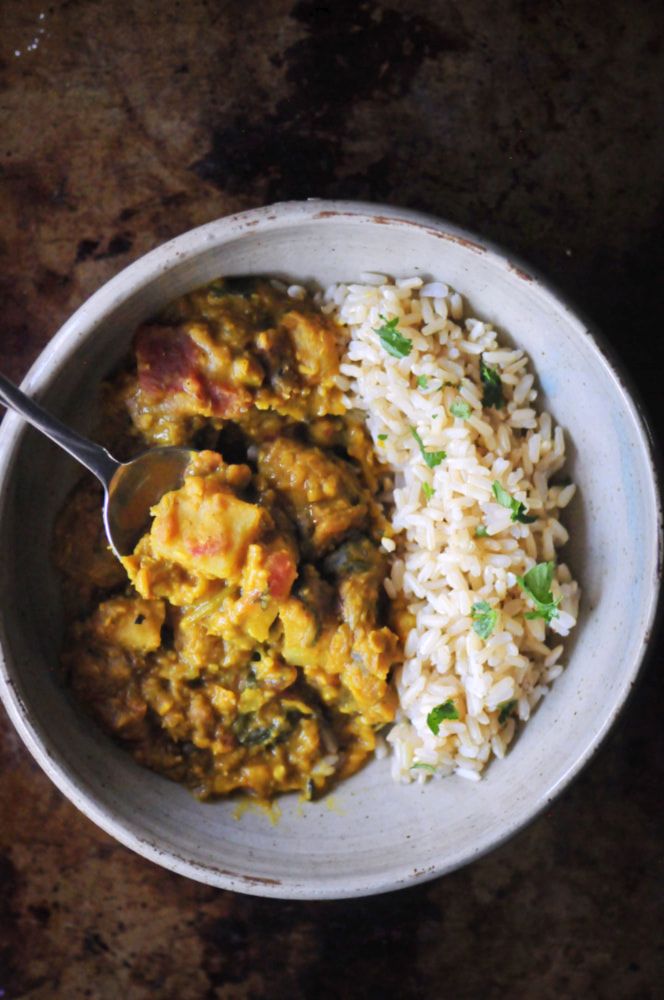 Bowl of rice and red lentil dal.