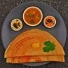 Plate of millet dosa with chutneys.