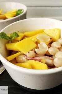 Bowl of boiled peanut mango salad.