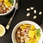 Bowls of peanut salad with mango.