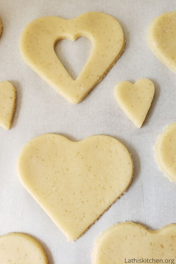 Cut out cookie dough in heart shape.