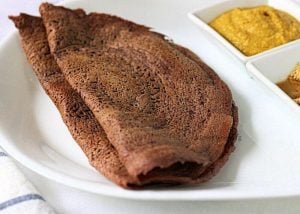 A plate with Ragi dosa and chutney.