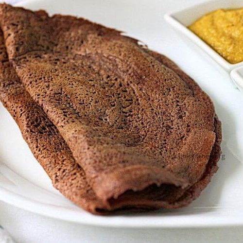 A plate with Ragi dosa and chutney.