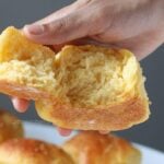Half opened dinner rolls.