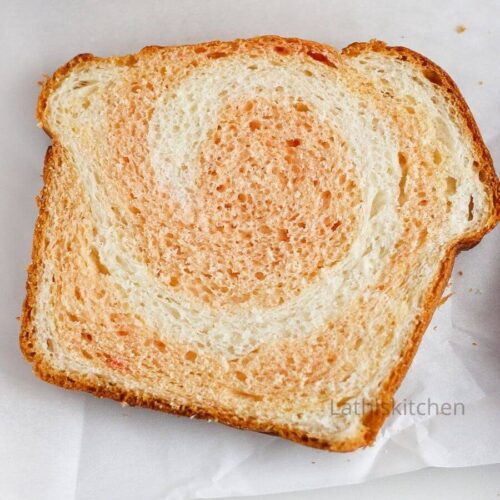 A slice of baked Instant pot bread with beetroot swirl.