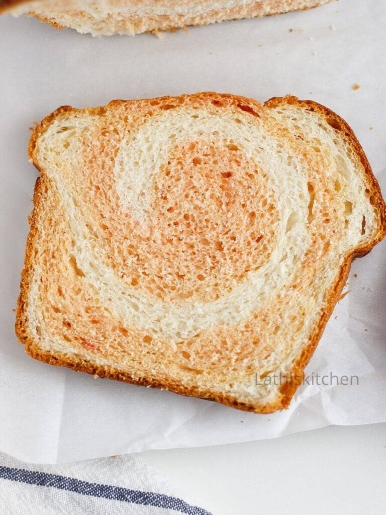 A slice of baked Instant pot bread with beetroot swirl.