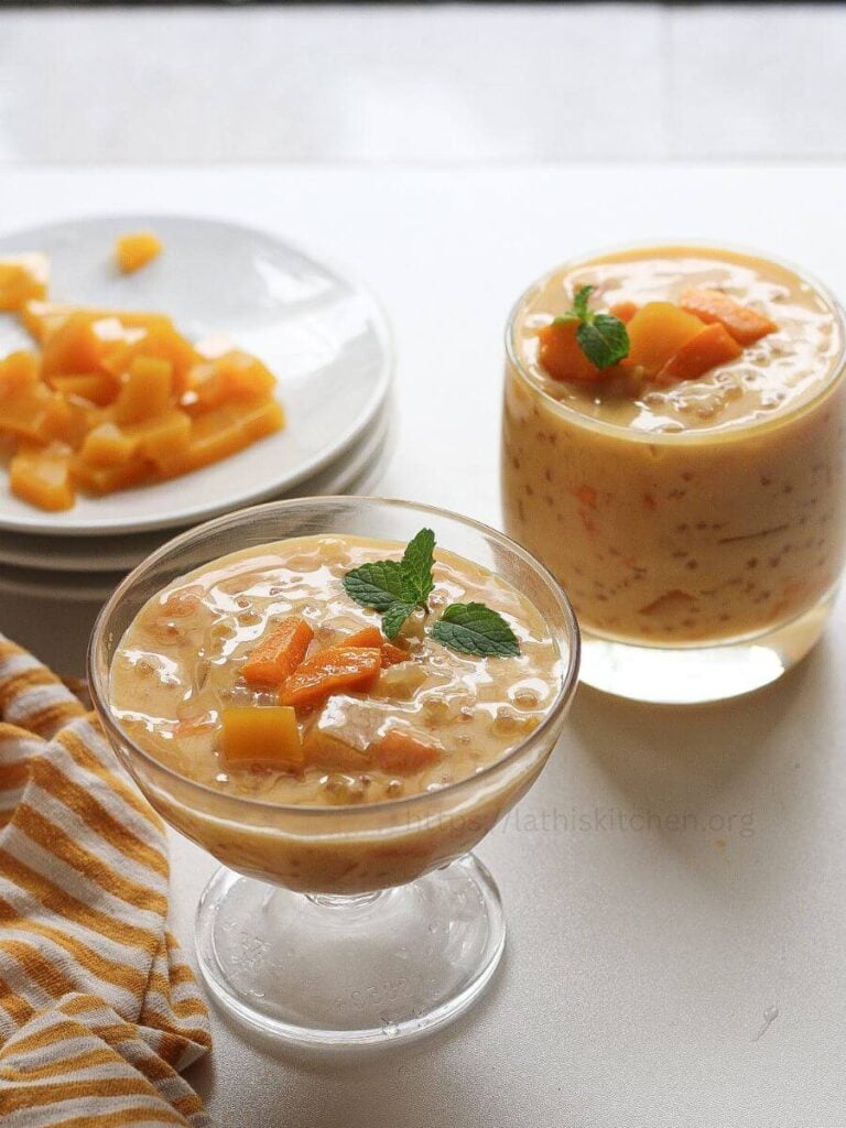 Mango sago in a glasses with mint leaves on top.